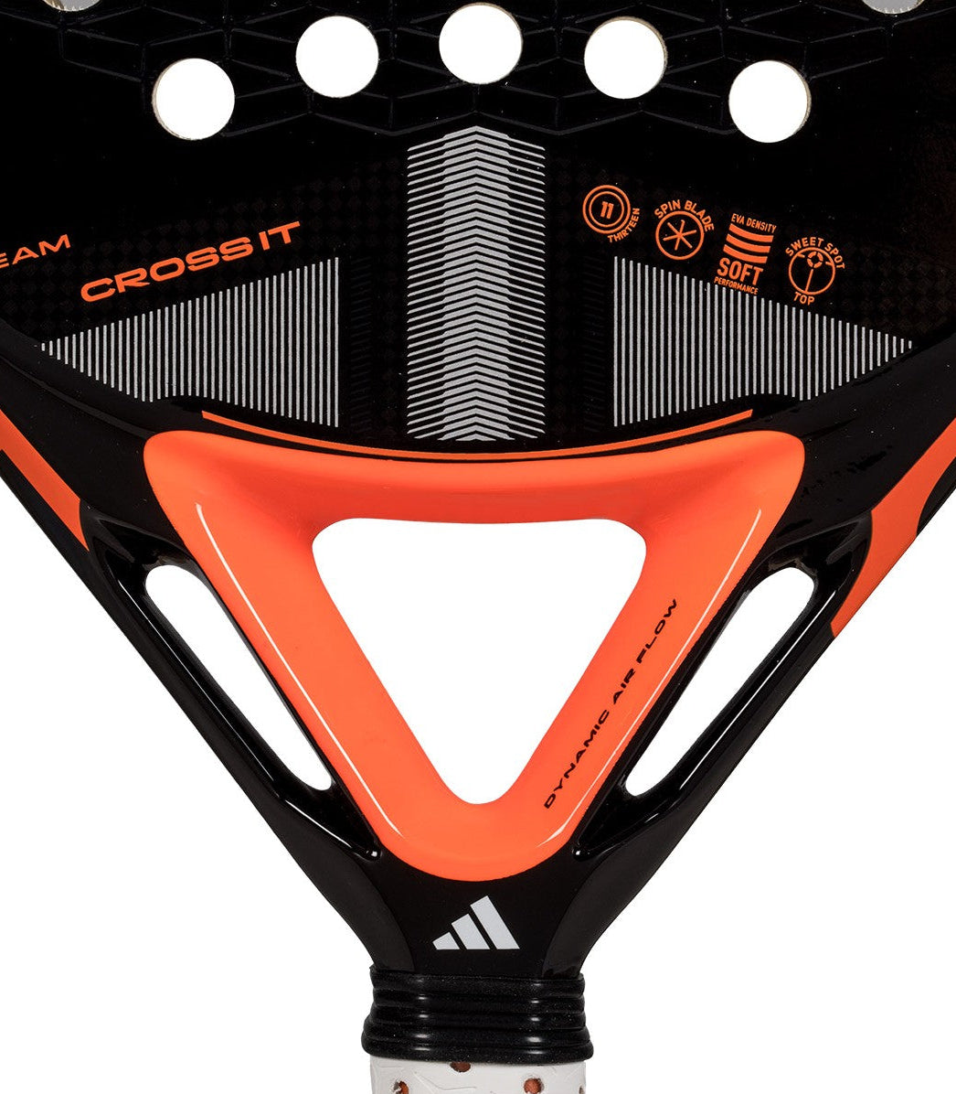 Black and orange Adidas padel tennis racket with a white logo, zoomed in.