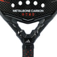 A close-up of a black Adidas Metalbone 2026 padel racket with orange detailing on a white background.