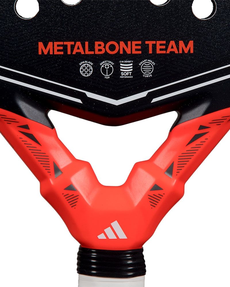 Close up of an Adidas Metalbone Team padel racket on a white background.