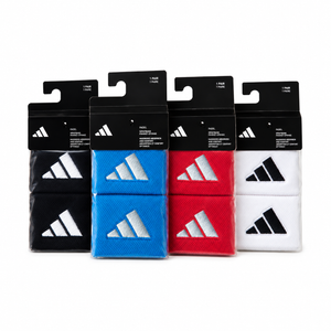 Black, blue, red and white Adidas padel wristbands, in black packaging on a white background.