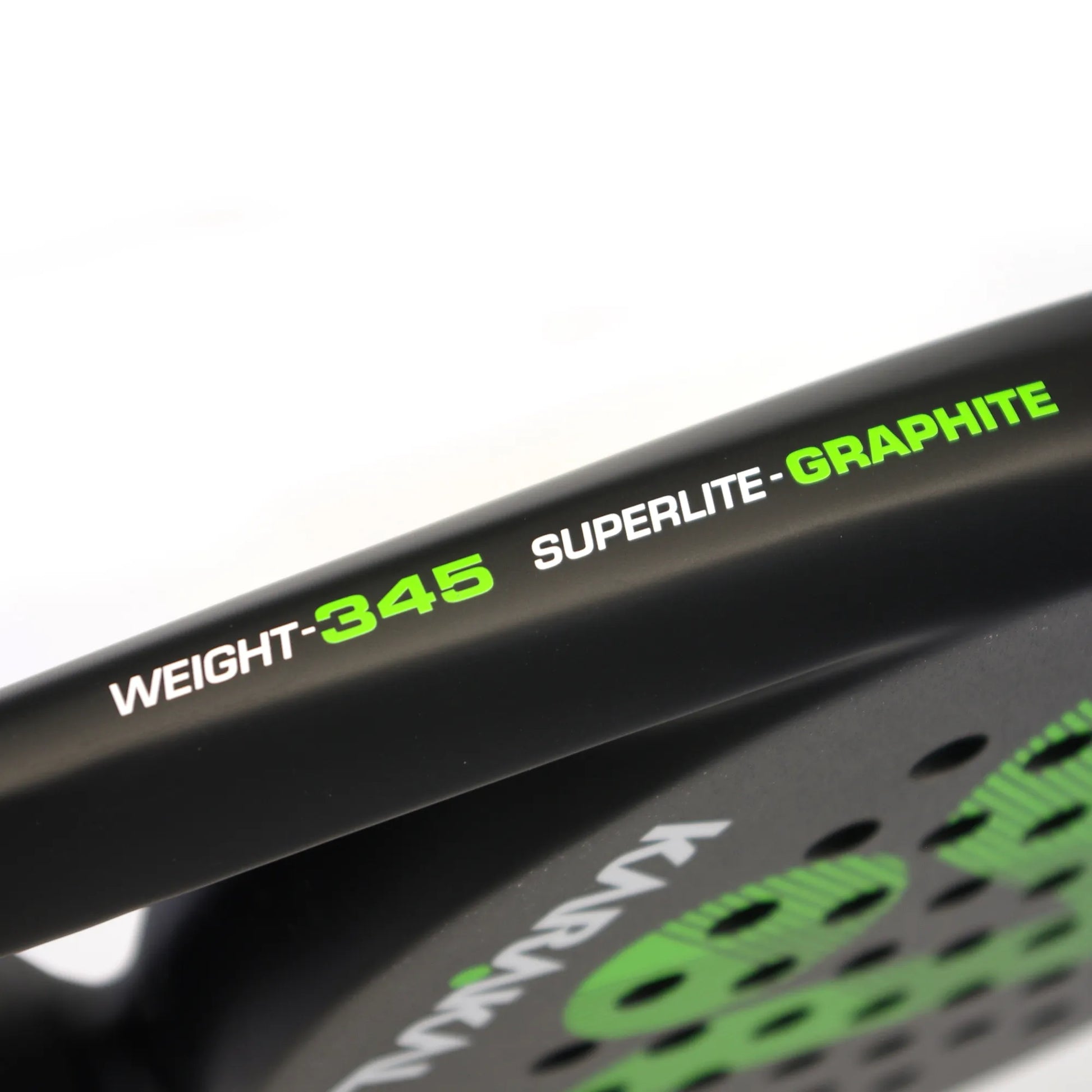 Close up of a black and green Karakal padel tennis racket on a white background.