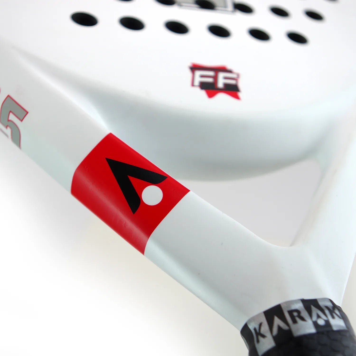 Close up of a matte white Karakal padel tennis racket on a white background.