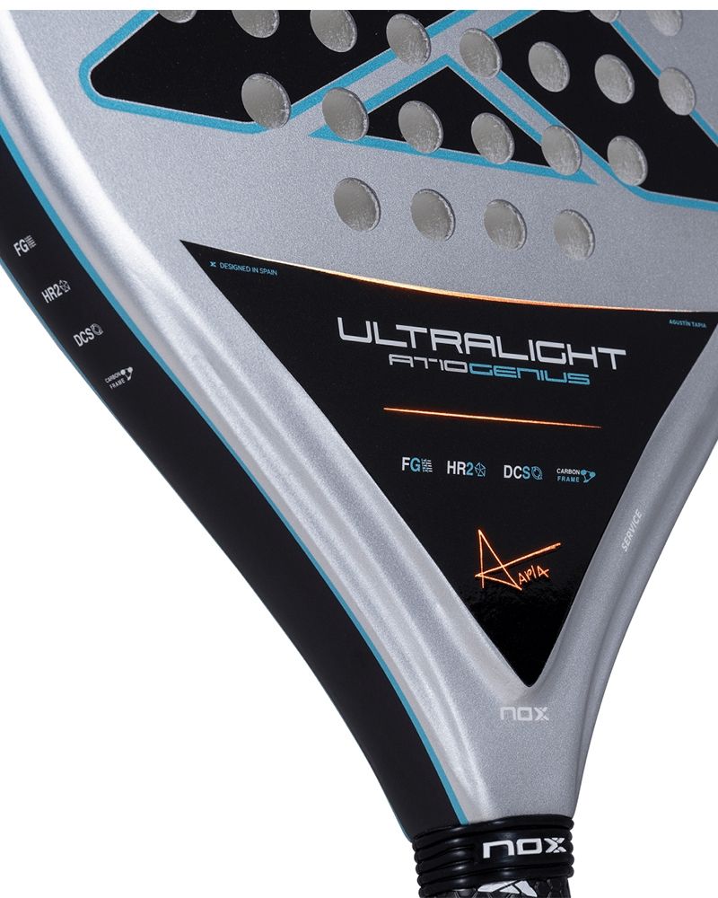 Close up of a grey Nox padel racket with black and blue branding on a white background.