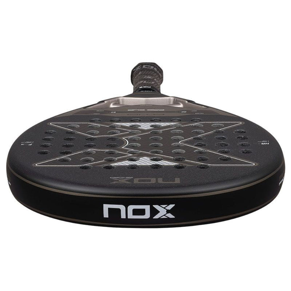 A black and copper Nox padel tennis racket on a white background.