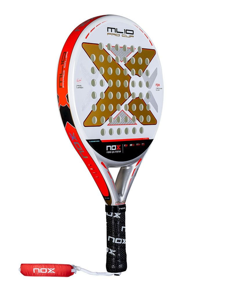 White and gold Nox padel racket with orange branding, on a white background.