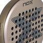 The face of a gold Nox Future padel racket on a white background.