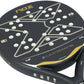 The face of a black and gold Nox Ultimate padel racket on a white background.