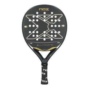 A black and gold Nox Ultimate padel racket on a white background.