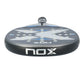 The top of a grey and blue Nox Ultimate padel racket on a white background.
