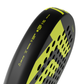 The side of a black and yellow Tecnifibre Bomba padel racket on a white background.
