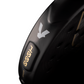 Close-up of a black Volt 1000 padel racket with a brand logo on a white background