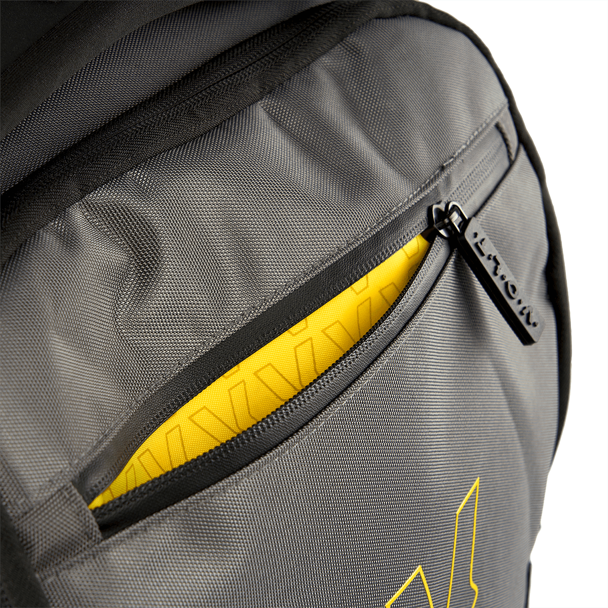 Gray backpack with yellow interior and visible brand logo on a white background