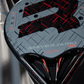 Close-up of a padel tennis racket with 'Aniversario' branding and red accents.